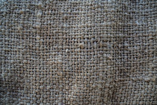 Hessian sackcloth woven texture pattern background in light cream yellow beige color