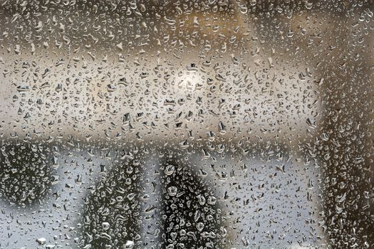 Raindrops on the window, abstract background. Seasonal concept