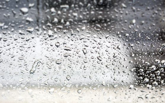 Raindrops on the window, abstract background. Seasonal concept