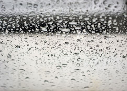 Raindrops on the window, abstract background. Seasonal concept