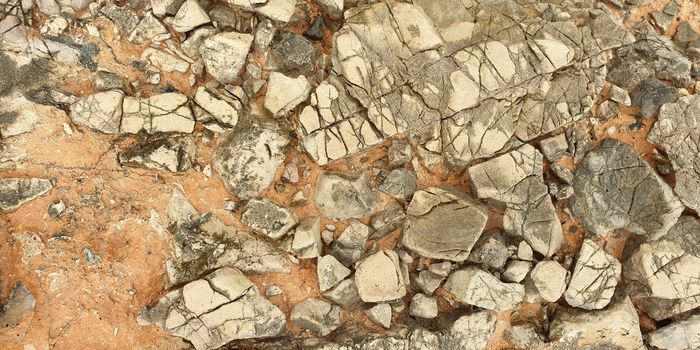 Texture of colorful Mediterranean stone on the shore