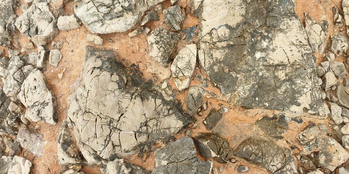 Texture of colorful Mediterranean stone on the shore