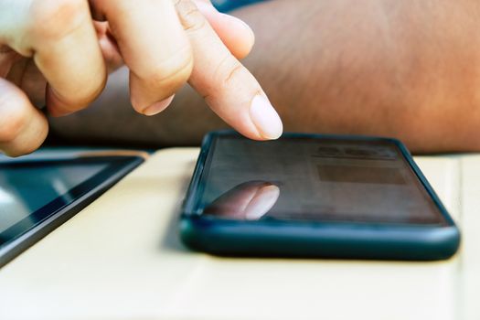 image of people using a smartphone.