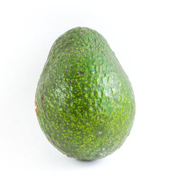 Close-up one whole avocado isolated on white background. Green, unripe organic Persea Americana, healthy fat fruit