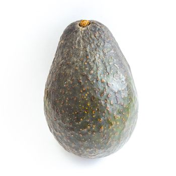 Close-up one whole avocado isolated on white background. Ripe organic Persea Americana, healthy fat fruit