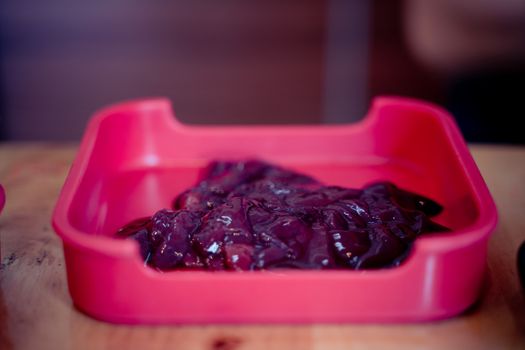 Raw turkey liver. Fresh raw turkey liver in red plate, Cooking food