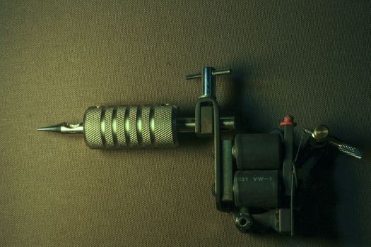 tattoo machine, with accessories and needles, tubes made in color background