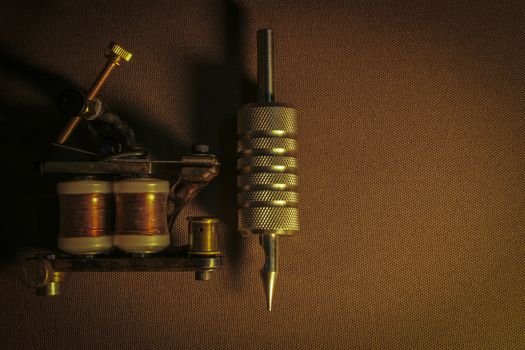 tattoo machine, with accessories and needles, tubes made in color background