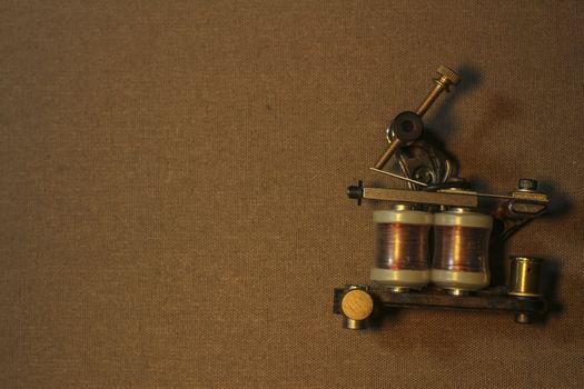 tattoo machine, with accessories and needles, tubes made in color background