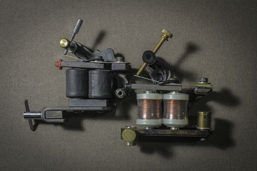 tattoo machine, with accessories and needles, tubes made in color background