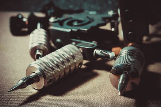 tattoo machine, with accessories and needles, tubes made in color background