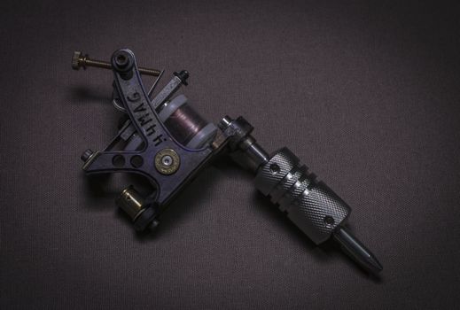 tattoo machine, with accessories and needles, tubes made in color background