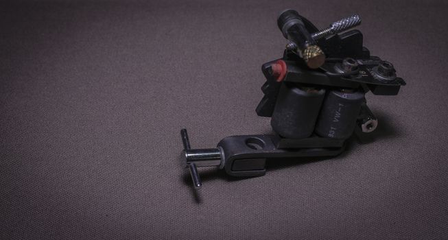 tattoo machine, with accessories and needles, tubes made in color background