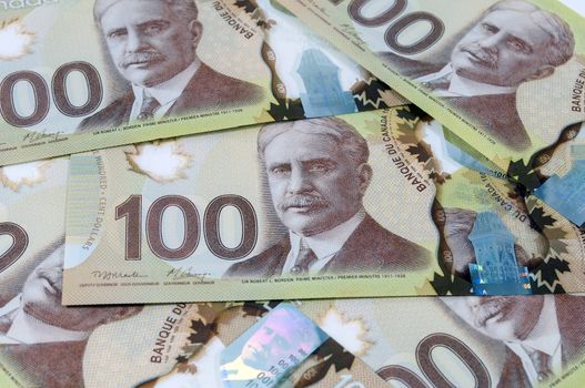 Close up view of new 100 Canadian dollar banknotes.