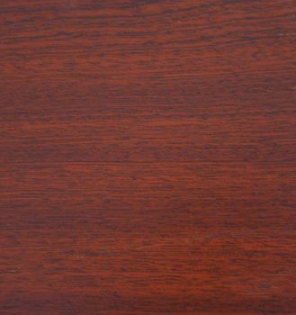 Mahogany, natural drawing of wood texture on a slice closeup. Background, texture.