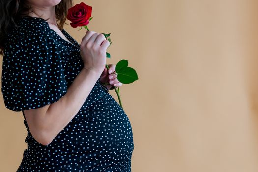 pregnant young woman in dark dress