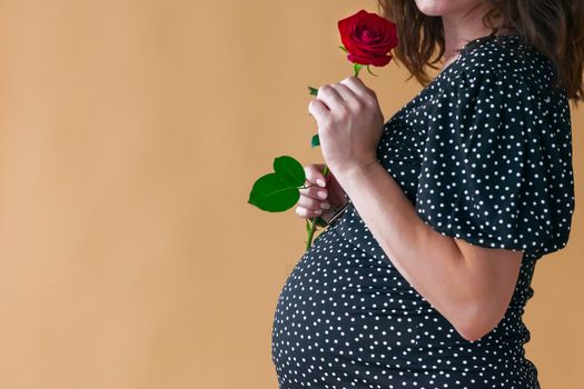 pregnant young woman in dark dress