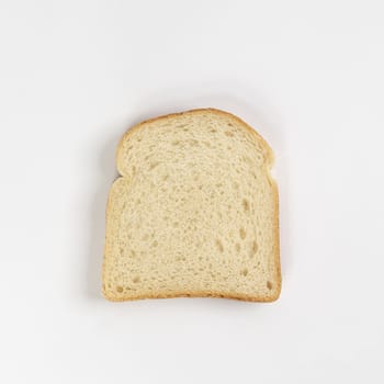 A slice of bread on a white surface