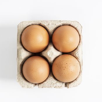 some eggs inside the cardboard containers