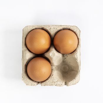 some eggs inside the cardboard containers