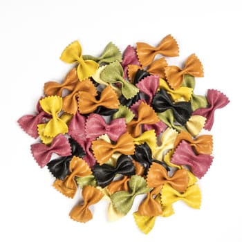 butterfly-shaped Italian pasta of various colors produced naturally