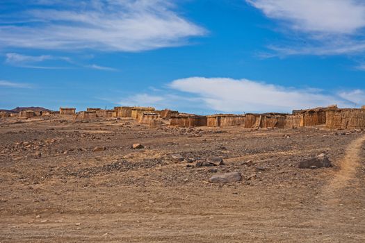 The houses are constructed with reeds from the banks of the Orange River in an attempt to escape the extreme desert climate of southern Namibia.