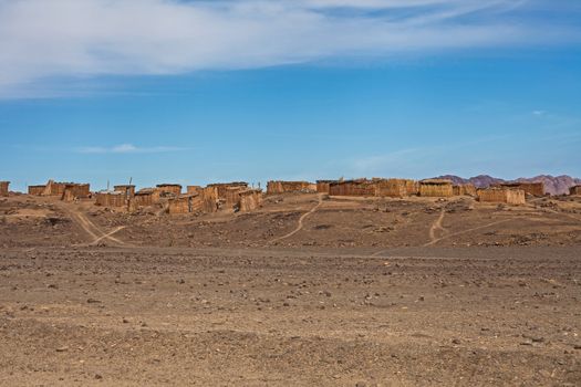 The houses are constructed with reeds from the banks of the Orange River in an attempt to escape the extreme desert climate of southern Namibia.