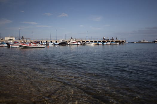 Boats moored at the pier in Mondello Sicily