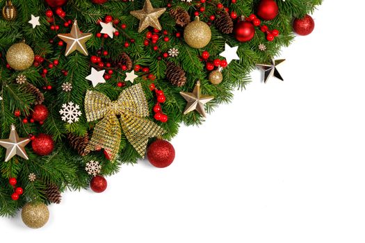 Christmas Border frame of tree branches on white background with copy space isolated, red and golden decor, berries, stars