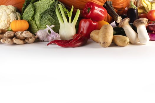 Harvest of many vegetables isolated on white background border frame with copy space for text