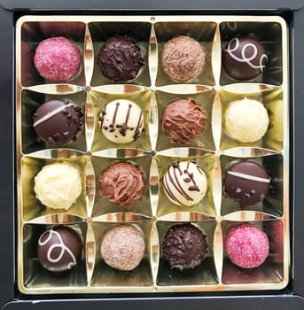 Close-Up Of Luxury Candies With White And Black Milk Chocolate