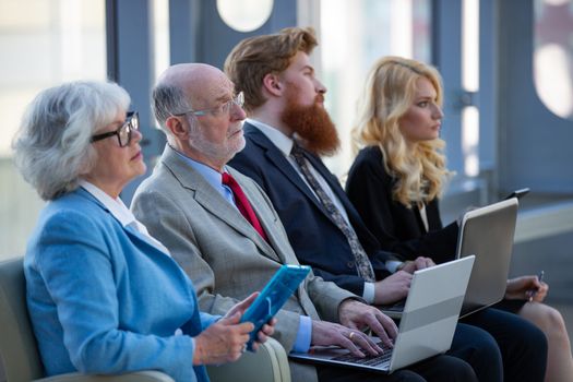 Business group in a meeting watching presentation