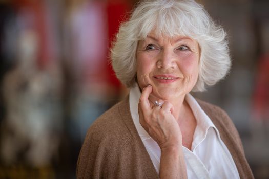 Portrait of beautiful senior woman in a shopping center