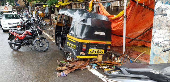 Pune, India - September 26, 2019: An autorickshaw or tuktuk destroyed during the floods in India.