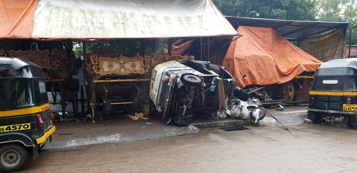 Pune, India - September 26, 2019: Vehicles crashed into each other after being carried in flood waters, in India.
