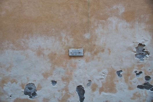 Street sign Divieto D'Affissione on the wall of a house in the center of Rome, Italy