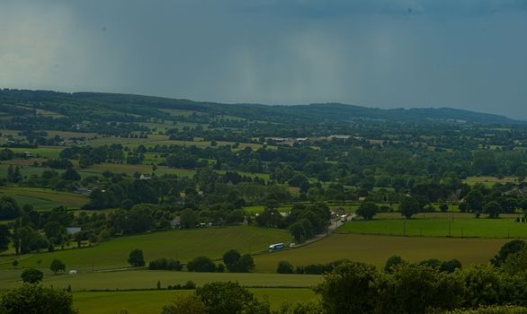 View from the hill on landscape in rural Normandy and storm forming in the distance