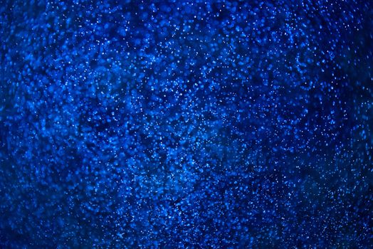 Abstract dark blue background of water and small bubbles bokeh
