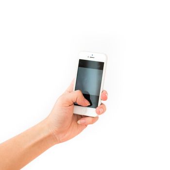 Studio shot of Asian man hand holding vertical white Smartphone with blank screen isolated on white background. Close-up finger taking photo on mobile phone concept with clipping path copy space