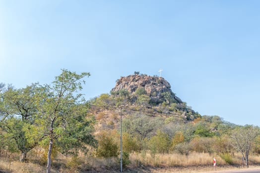 A road landscape on road R71 near Phalaborwa. A cross is visible on a hill