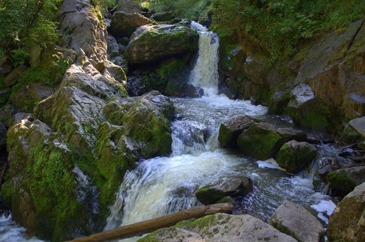 Cascade of waterfalls on a small mountain river. The third river, Altai, Russia.