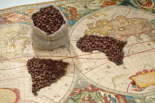 Coffee beans on an old world map