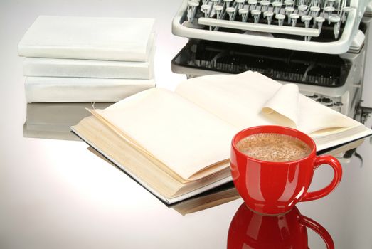 Cup of coffee, books and typewriter on a glass background