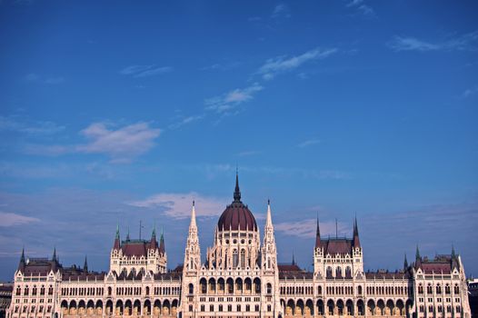 Front view of the Hungarian Parliament building from the Danube side on a beautiful day.