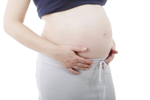 Closeup of pregnant woman at white background