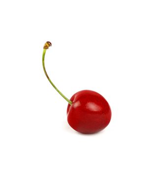 Close up one fresh red ripe sweet cherry berry isolated on white background, low angle side view
