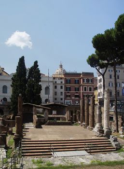 Photo of Archaeological site close to where Julius Caesar was killed. Placed among modern apartment buildings at Largo di Torre Argentina street, Rome, Italy