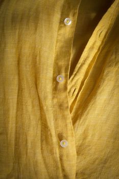 Close up of shirt yellow textile texture 