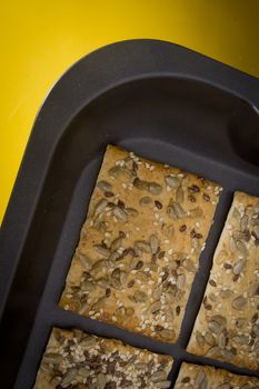 Salted crispy crackers with sesame and sunflower seeds