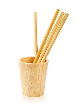 Ecological bamboo straws tube and wooden glass isolated on white background, Save clipping path.